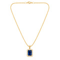 A gold chain necklace with a rectangular halo pendant featuring a deep blue emerald-cut center stone surrounded by small clear stones, shown on a light gray background.